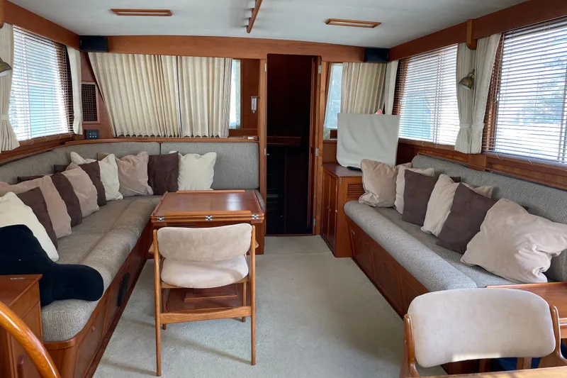 Daddy's Dream Yacht Photos Pics Interior of 1991 Grand Banks 46 Motoryacht with cozy seating and wooden accents.