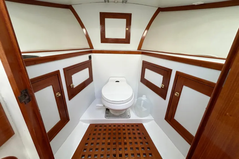 Nellie Yacht Photos Pics Luxurious 1995 Holland Pettegrow Cruiser bathroom with wooden accents and modern fixtures.