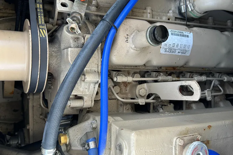 Nellie Yacht Photos Pics Engine components of a 1995 Holland Pettegrow Cruiser, featuring belts and hoses.