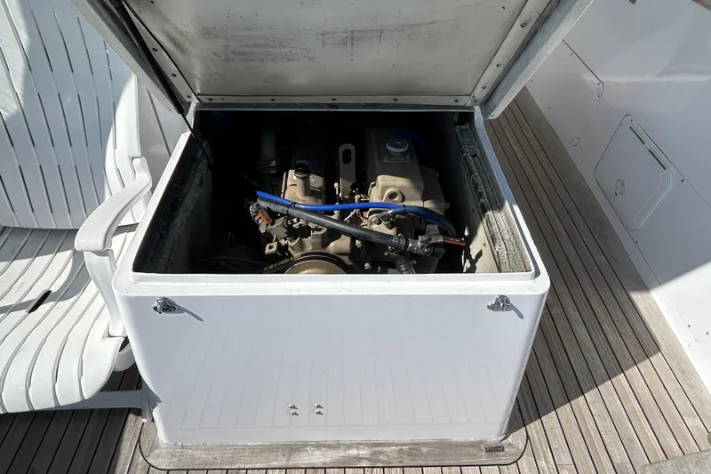 Nellie Yacht Photos Pics Engine compartment of a 1995 Holland Pettegrow Cruiser, showcasing mechanical components.