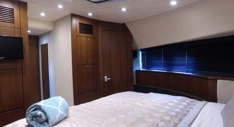  Yacht Photos Pics Luxurious bedroom interior of 2014 Fairline Squadron 78 Custom yacht with modern decor.