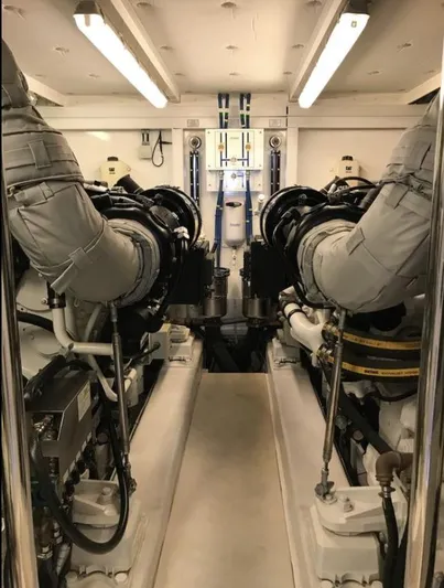  Yacht Photos Pics Engine room of 2014 Fairline Squadron 78 Custom yacht, showcasing dual engines and mechanical systems.