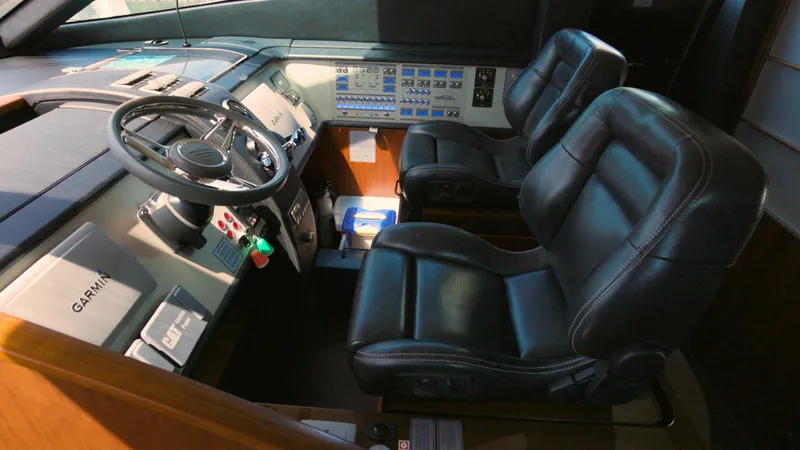  Yacht Photos Pics Interior cockpit of 2014 Fairline Squadron 78 Custom yacht with leather seats and control panel.