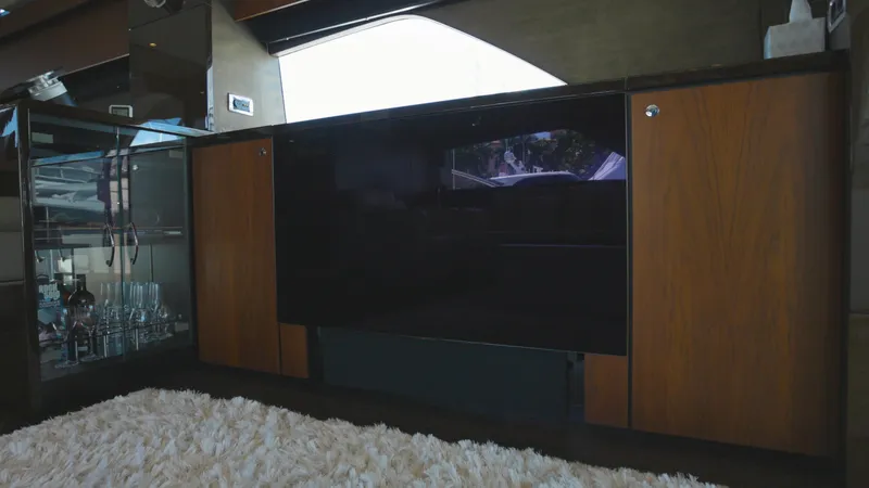  Yacht Photos Pics Interior of 2014 Fairline Squadron 78 Custom yacht with modern cabinetry and plush carpet.