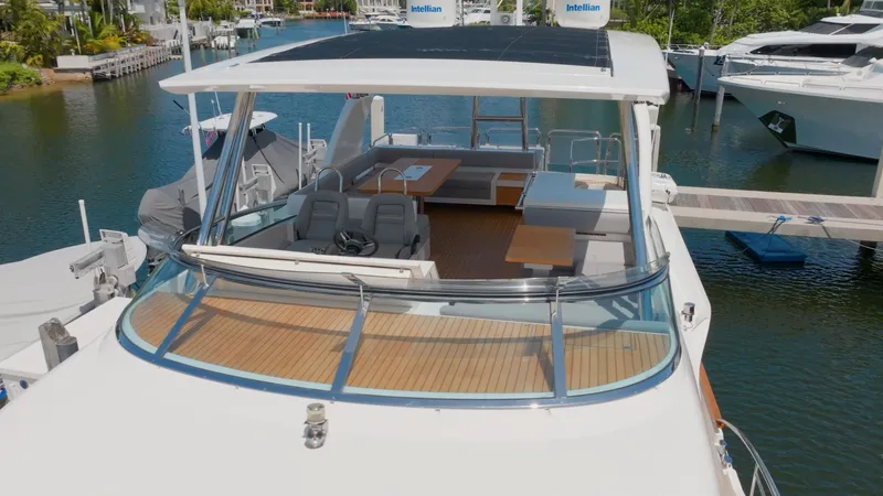  Yacht Photos Pics 2014 Fairline Squadron 78 Custom yacht docked, featuring spacious deck and seating area.