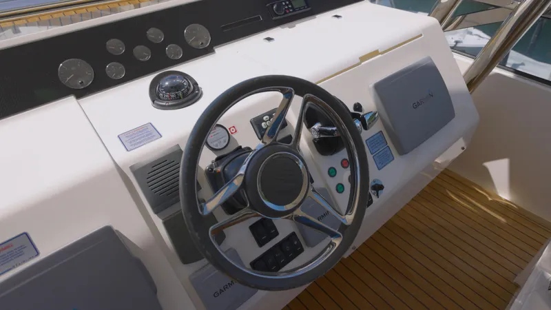  Yacht Photos Pics 2014 Fairline Squadron 78 Custom yacht helm with steering wheel and control panel.