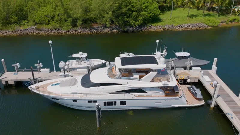  Yacht Photos Pics 2014 Fairline Squadron 78 Custom yacht docked in a serene marina setting.