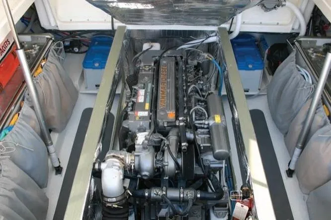 Kikiriki Yacht Photos Pics Engine compartment of 2007 MJM 34z Downeast boat, showcasing detailed mechanical components.