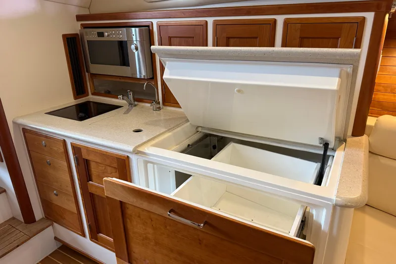 Kikiriki Yacht Photos Pics 2007 MJM 34z Downeast yacht galley with microwave, sink, and storage.