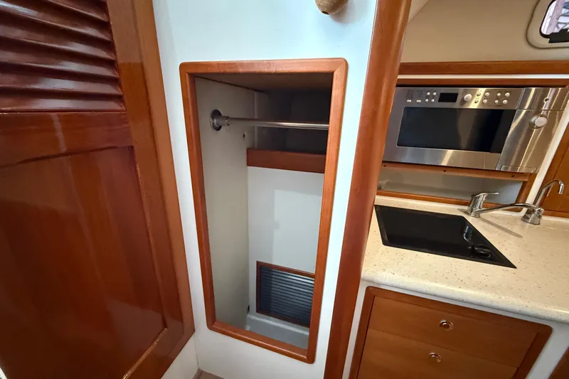 Kikiriki Yacht Photos Pics 2007 MJM 34z Downeast yacht interior with kitchenette and storage space.