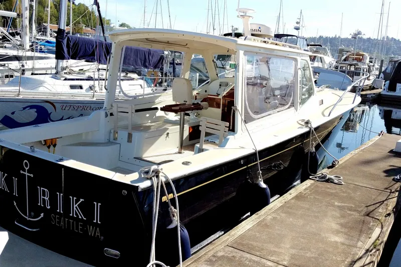 Kikiriki Yacht Photos Pics 2007 MJM 34z Downeast boat docked in marina, Seattle, WA.