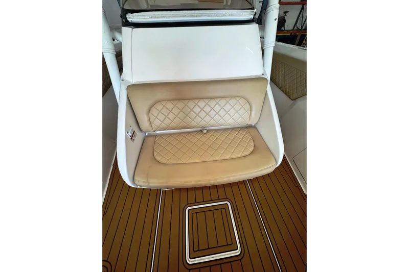 T/t Jodi Ann Yacht Photos Pics 2019 Intrepid 345 Nomad FE boat with tan quilted seating and teak flooring.
