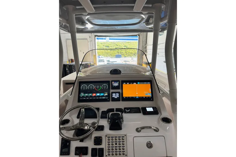 T/t Jodi Ann Yacht Photos Pics 2019 Intrepid 345 Nomad FE boat dashboard with modern navigation displays.