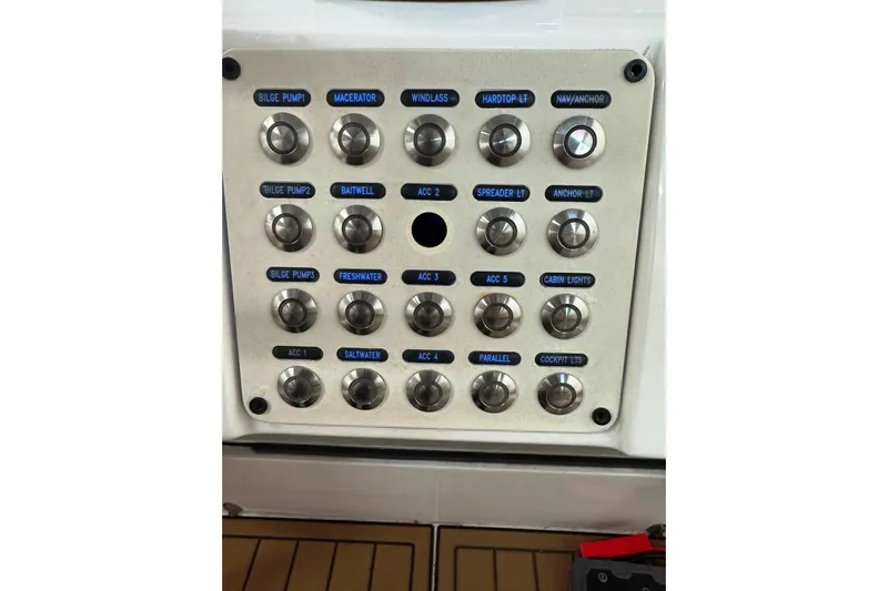 T/t Jodi Ann Yacht Photos Pics Control panel of a 2019 Intrepid 345 Nomad FE boat with labeled switches.