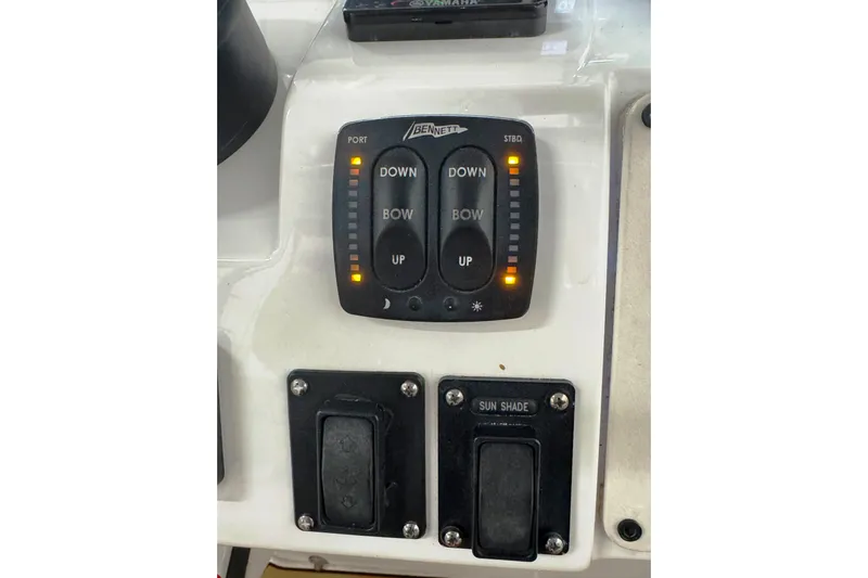 T/t Jodi Ann Yacht Photos Pics Control panel of a 2019 Intrepid 345 Nomad FE boat with trim tab switches.
