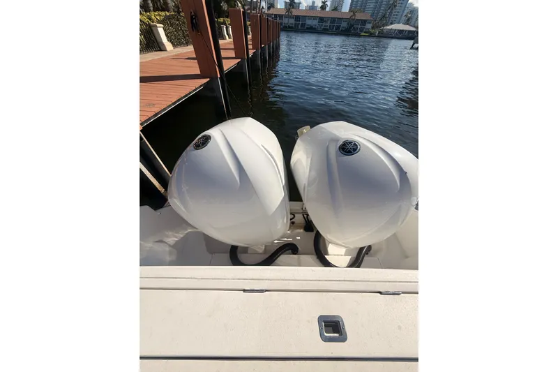 T/t Jodi Ann Yacht Photos Pics 2019 Intrepid 345 Nomad FE with dual outboard engines docked by the water.