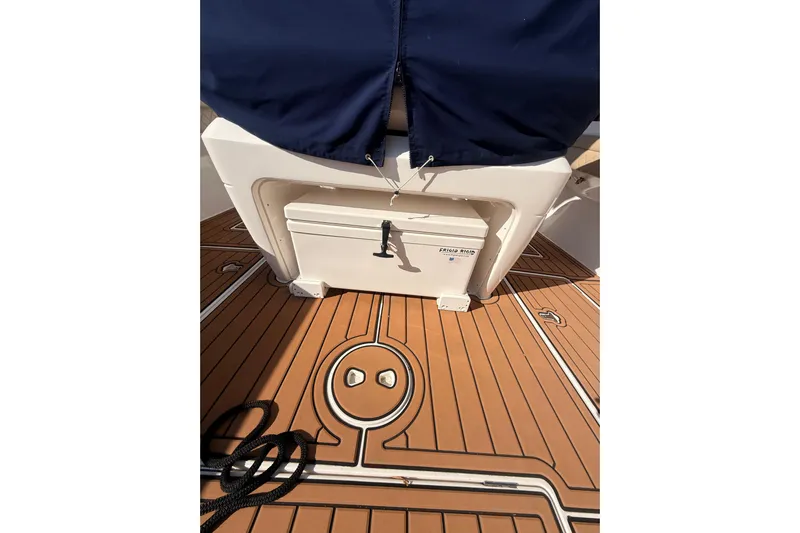 T/t Jodi Ann Yacht Photos Pics 2019 Intrepid 345 Nomad FE boat deck with storage compartment and rope.