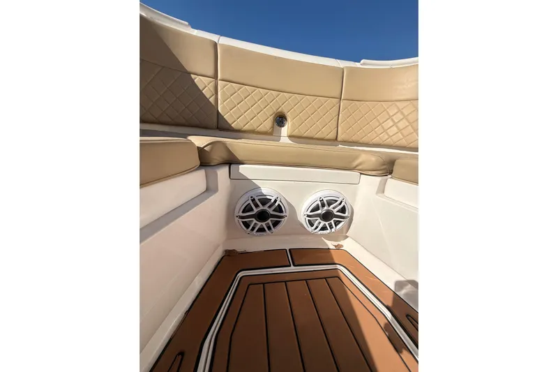 T/t Jodi Ann Yacht Photos Pics Interior of 2019 Intrepid 345 Nomad FE boat with tan seating and speakers.