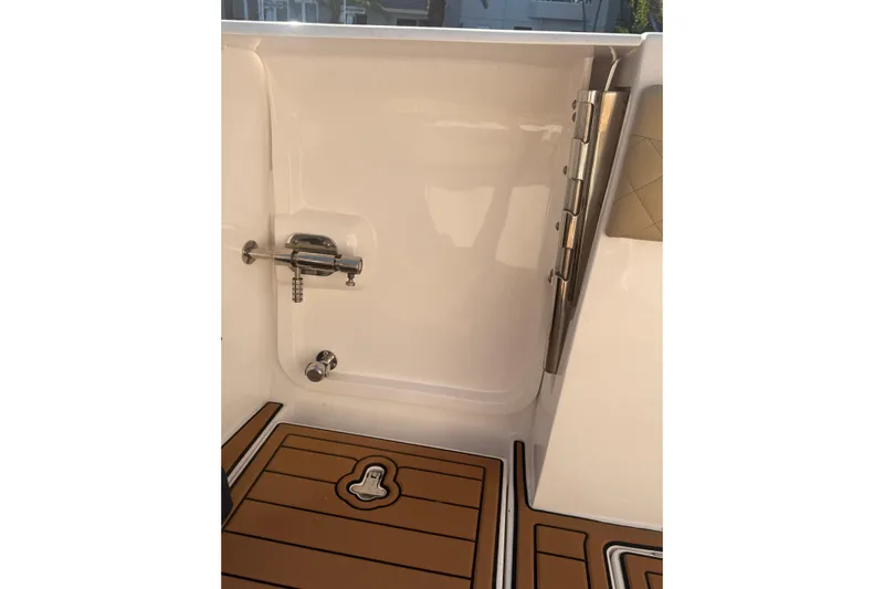 T/t Jodi Ann Yacht Photos Pics 2019 Intrepid 345 Nomad FE boat interior with teak flooring and stainless steel hardware.