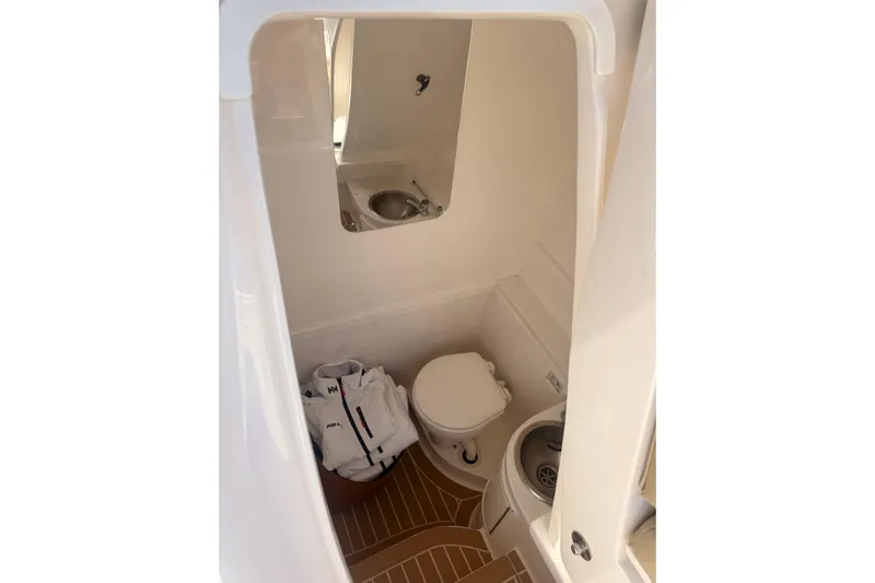 T/t Jodi Ann Yacht Photos Pics 2019 Intrepid 345 Nomad FE boat bathroom with sink and toilet.
