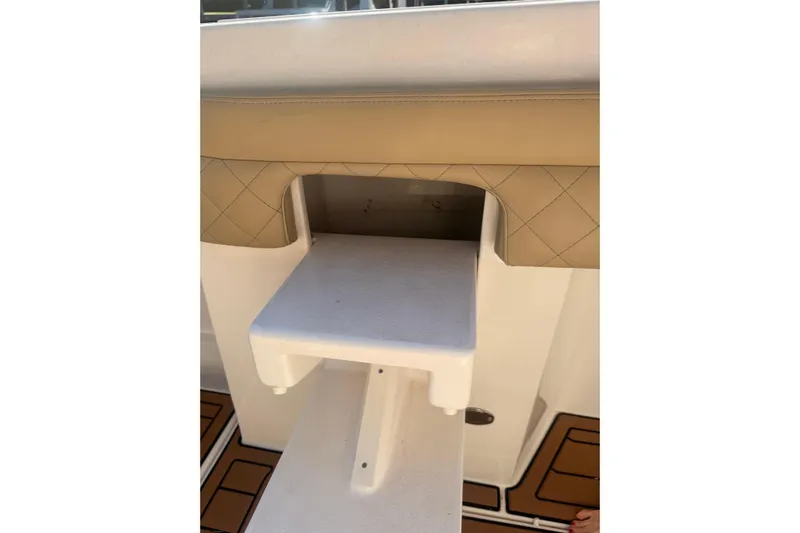 T/t Jodi Ann Yacht Photos Pics 2019 Intrepid 345 Nomad FE boat interior with cushioned seating and step detail.