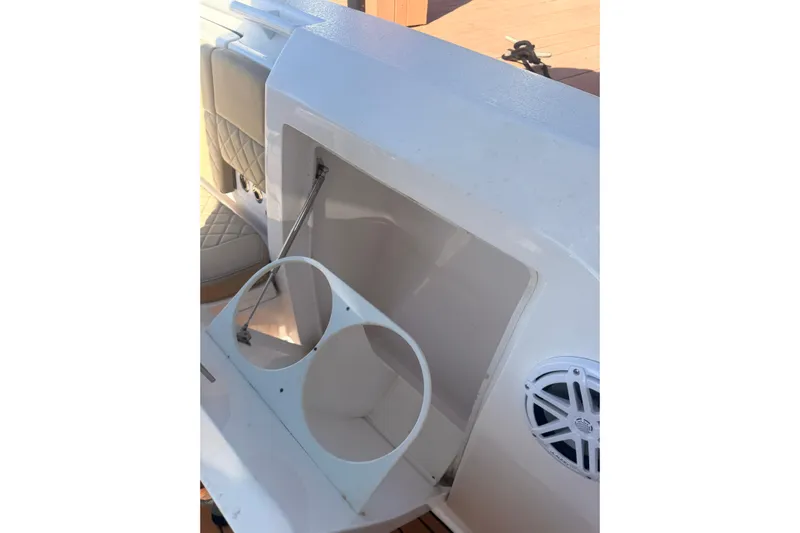 T/t Jodi Ann Yacht Photos Pics 2019 Intrepid 345 Nomad FE boat interior with cup holders and speaker.