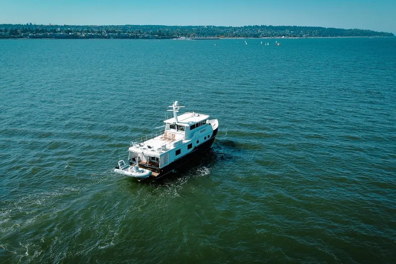 North Yacht Photos Pics 2002 Darling Yachts Custom Aluminum cruising on open water under clear skies.