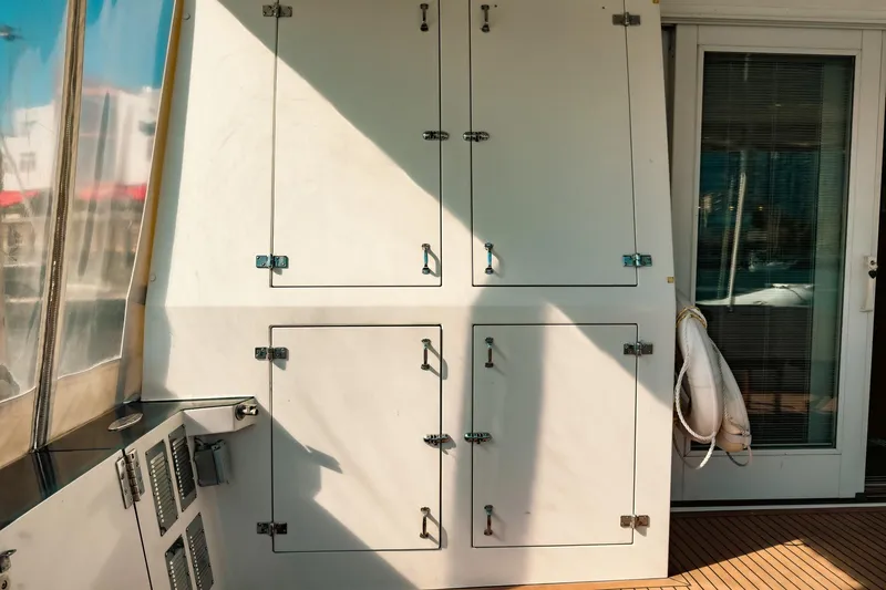 North Yacht Photos Pics 2002 Darling Yachts Custom Aluminum interior with storage cabinets and life preserver.