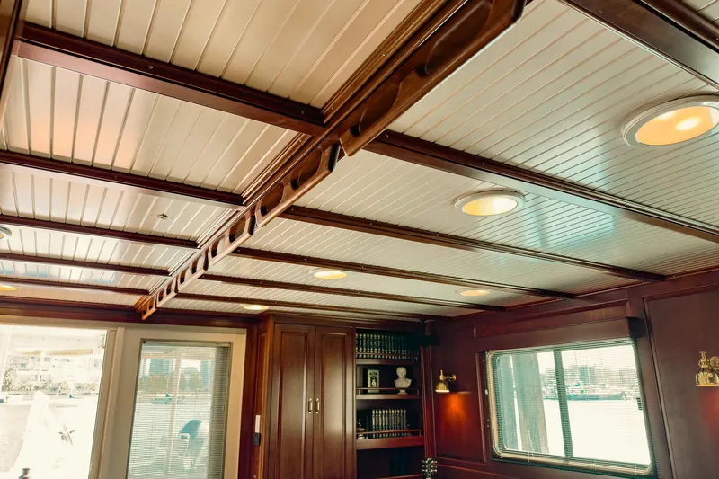 North Yacht Photos Pics Luxurious yacht interior with wooden paneling, recessed lighting, and bookshelf. Darling Yachts Custom Aluminum, 2002.