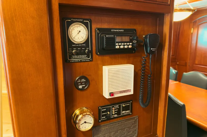 North Yacht Photos Pics Control panel on 2002 Darling Yachts Custom Aluminum, featuring gauges and communication equipment.