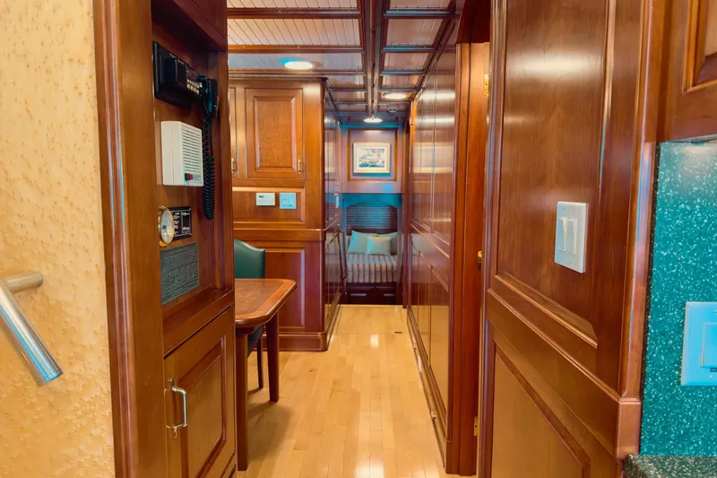 North Yacht Photos Pics Luxurious wooden interior of 2002 Darling Yachts Custom Aluminum, featuring elegant cabin design.