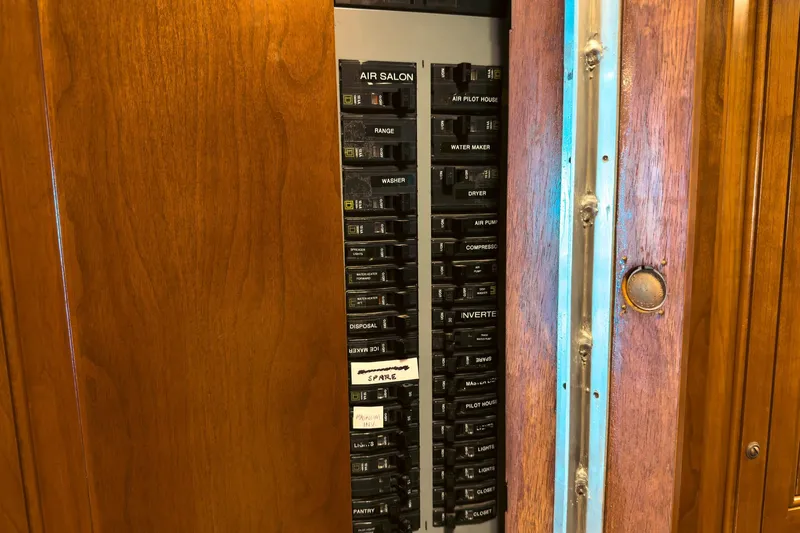 North Yacht Photos Pics Electrical panel inside 2002 Darling Yachts Custom Aluminum, featuring various labeled switches.