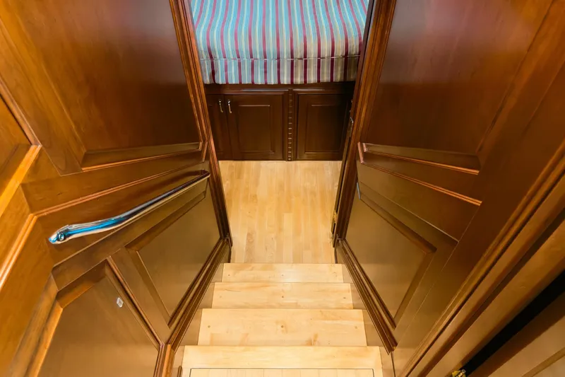 North Yacht Photos Pics Staircase leading to a cozy cabin with wooden interior on a 2002 Darling Yachts Custom Aluminum.