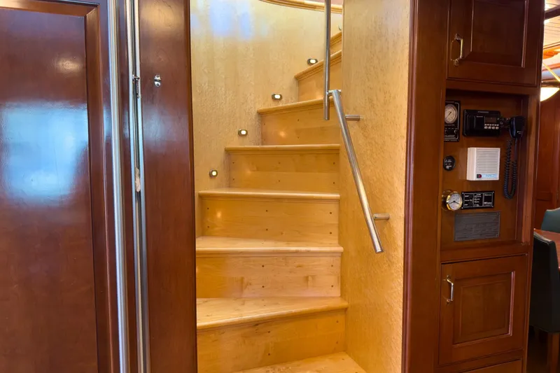 North Yacht Photos Pics Interior of 2002 Darling Yachts Custom Aluminum, featuring wooden stairs and control panel.