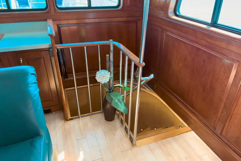 North Yacht Photos Pics Interior of 2002 Darling Yachts Custom Aluminum, featuring wooden paneling and staircase.