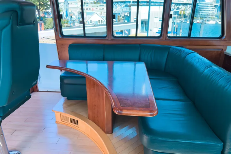 North Yacht Photos Pics Luxurious interior of 2002 Darling Yachts Custom Aluminum with elegant seating and table.