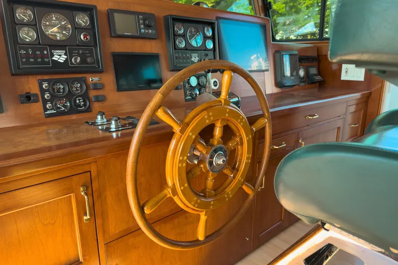 North Yacht Photos Pics Helm of 2002 Darling Yachts Custom Aluminum with wooden wheel and navigation instruments.
