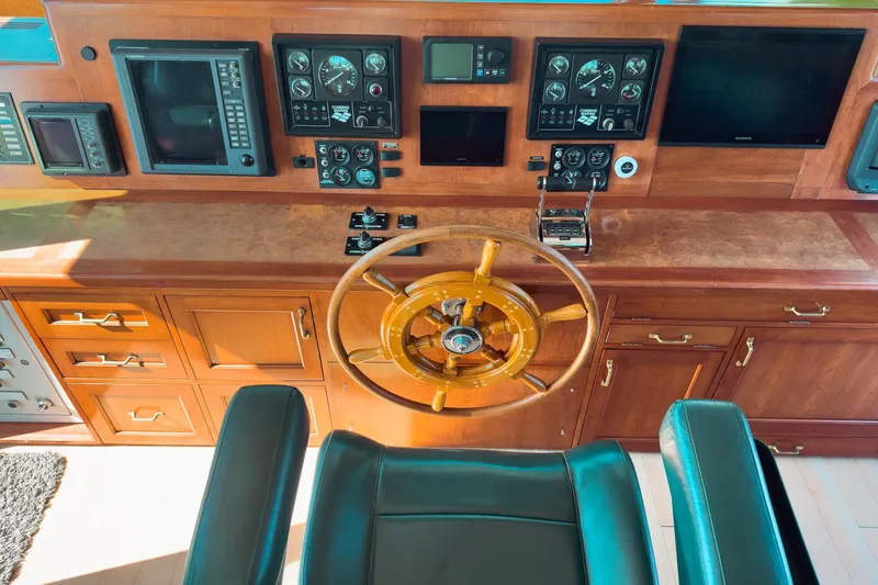 North Yacht Photos Pics Helm of 2002 Darling Yachts Custom Aluminum with wooden wheel and navigation instruments.