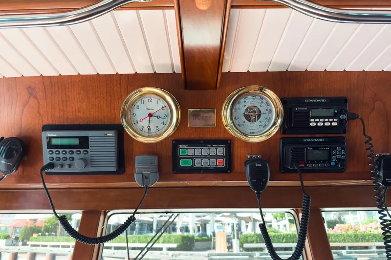 North Yacht Photos Pics Control panel of 2002 Darling Yachts Custom Aluminum with gauges and communication devices.
