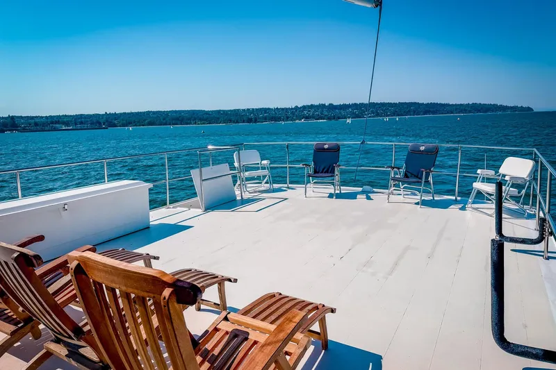 North Yacht Photos Pics Spacious deck of 2002 Darling Yachts Custom Aluminum, overlooking serene blue waters.