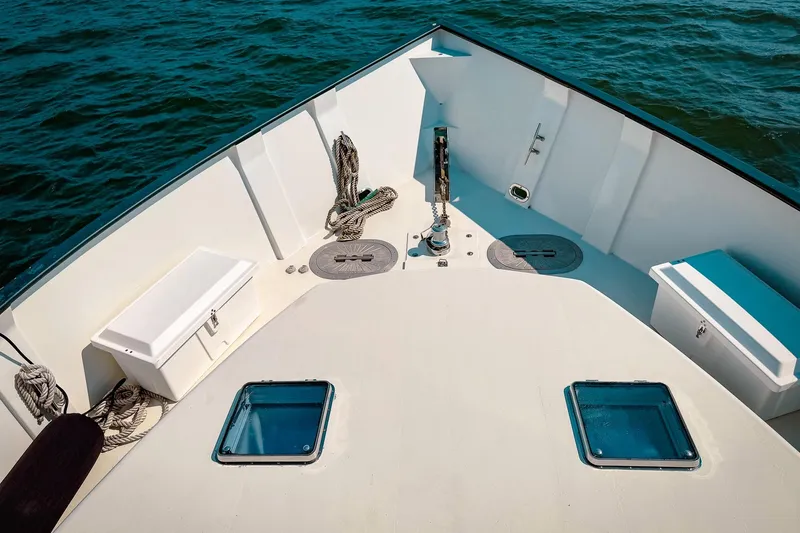 North Yacht Photos Pics Bow view of 2002 Darling Yachts Custom Aluminum on water, featuring deck details.