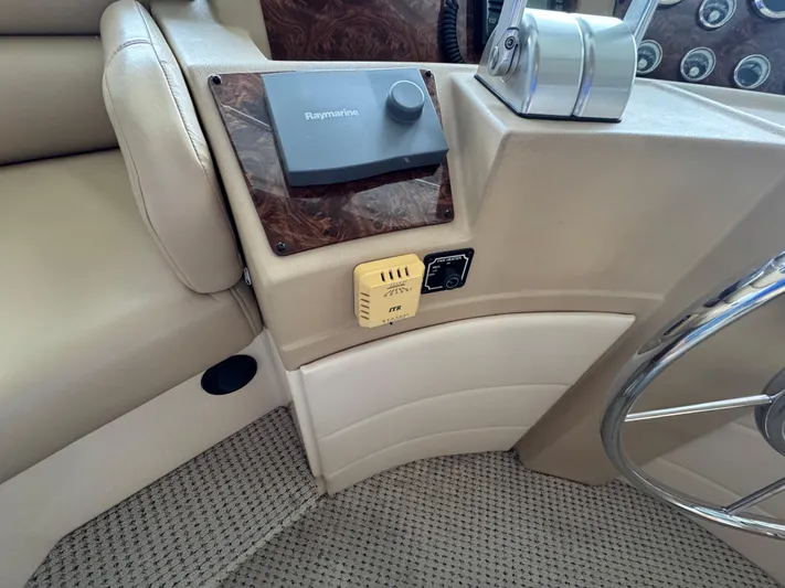  Yacht Photos Pics 2005 Meridian 490 Pilothouse helm with Raymarine equipment and controls.