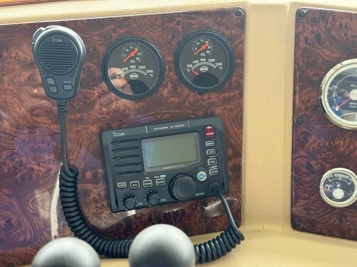  Yacht Photos Pics Control panel of a 2005 Meridian 490 Pilothouse with gauges and Icom marine radio.