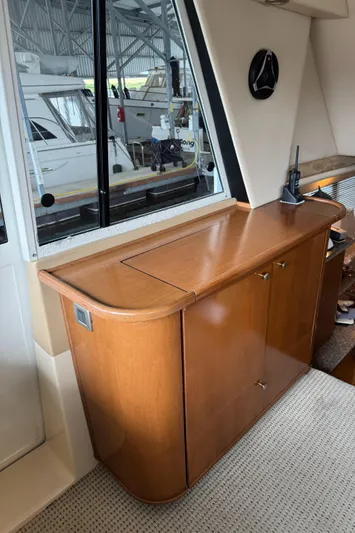  Yacht Photos Pics 2005 Meridian 490 Pilothouse interior with wooden cabinetry and window view.