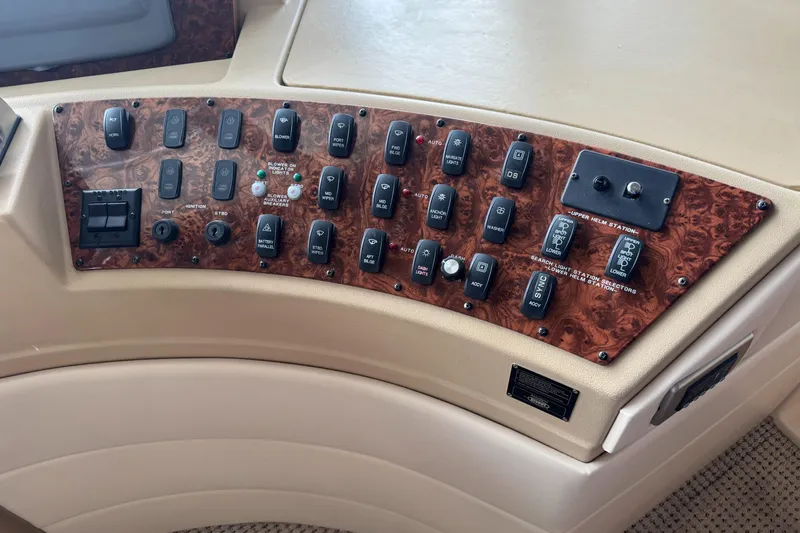  Yacht Photos Pics Control panel of a 2005 Meridian 490 Pilothouse yacht with various switches and buttons.