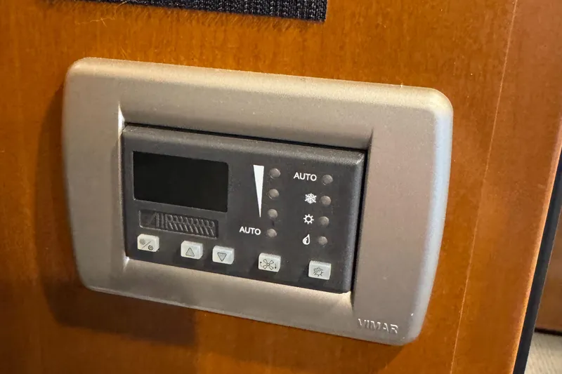  Yacht Photos Pics Control panel on 2005 Meridian 490 Pilothouse yacht, featuring various function buttons.