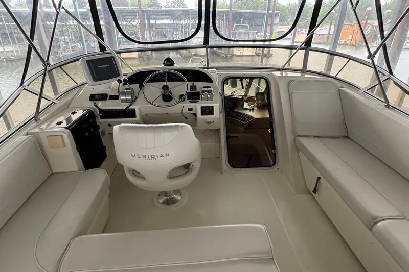  Yacht Photos Pics 2005 Meridian 490 Pilothouse interior with helm, seating, and navigation equipment.