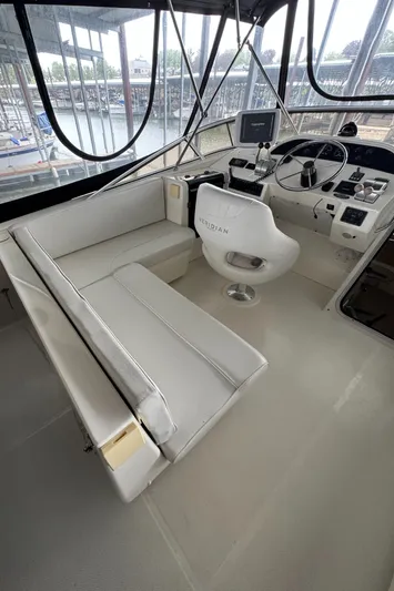  Yacht Photos Pics 2005 Meridian 490 Pilothouse interior with helm, seating, and navigation equipment.
