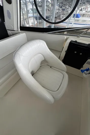  Yacht Photos Pics White captain's chair in 2005 Meridian 490 Pilothouse boat interior.