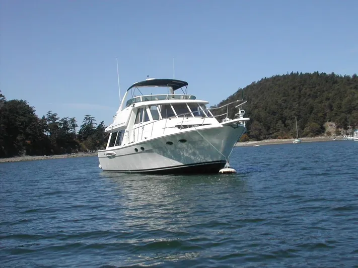  Yacht Photos Pics 2005 Meridian 490 Pilothouse yacht anchored in scenic coastal waters.